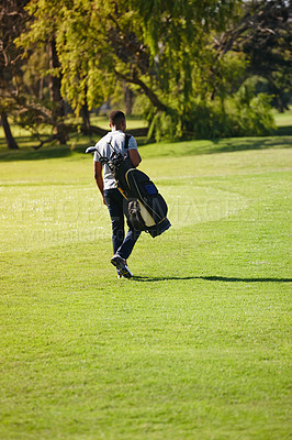 Buy stock photo Sports, bag and walking on golf course with man or athlete outdoor on luxury holiday or vacation. Grass, field and exercise in summer on lawn with person in countryside for training or workout