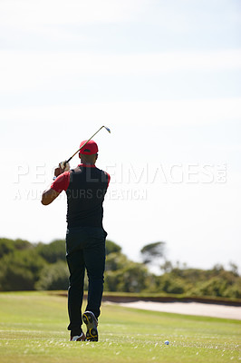 Buy stock photo Man, playing and golf course with club for stroke, point or strike on grass field in nature. Rear view of male person or sports player hitting ball or swing for game, match or outdoor competition