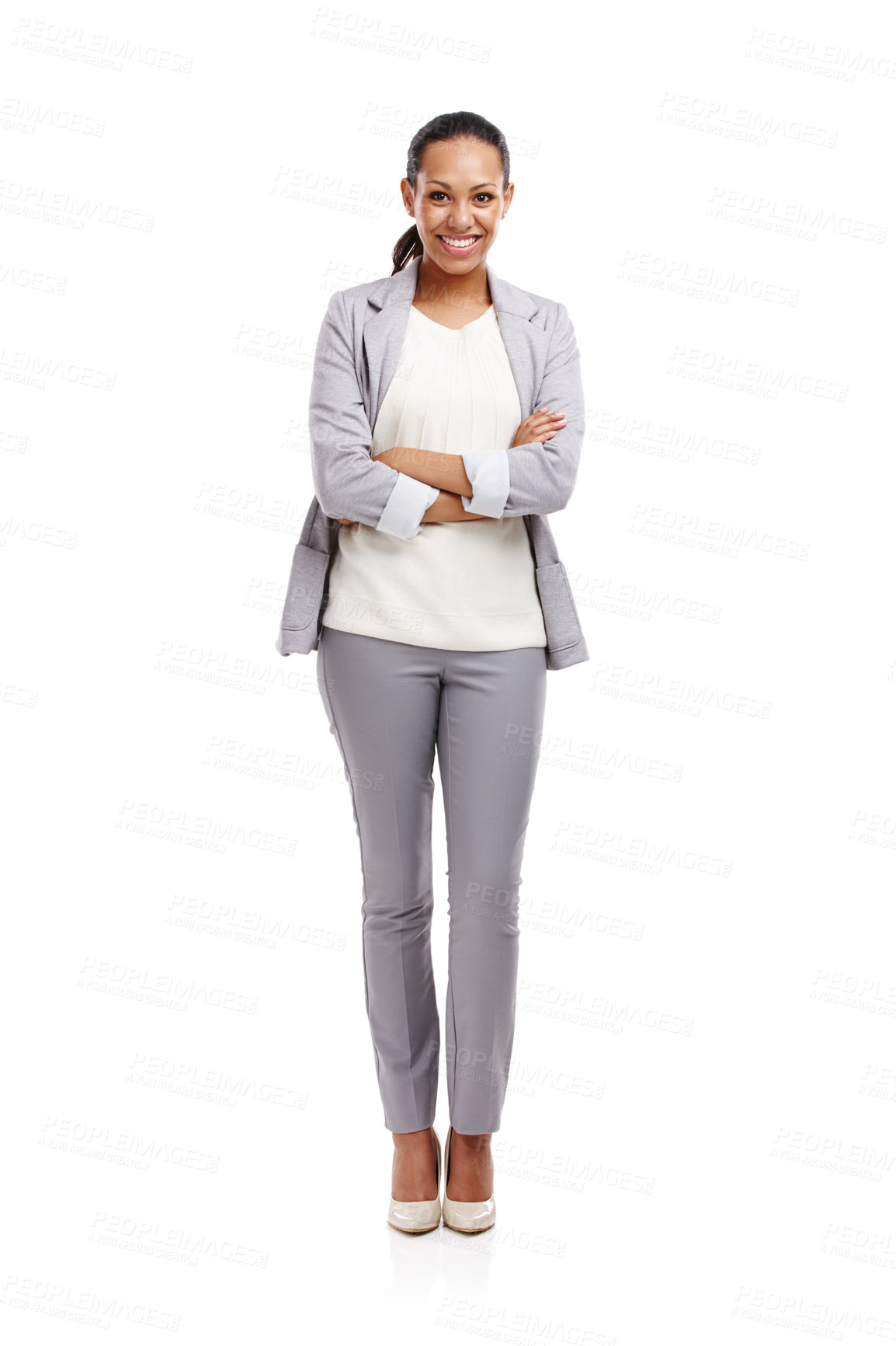 Buy stock photo Full length shot of an attractive young woman standing in a studio with her arms crossed 