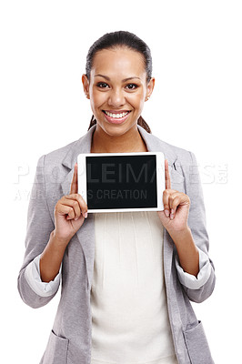 Buy stock photo Cropped shot of a gorgeous young woman standing in a studio holding a digital tablet 