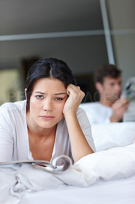 Buy stock photo Woman, bored and bed with magazine and boyfriend for couple, problem or breakup for argument in home. Mexican female person and sad with book on blanket for stress, relationship and frustrated