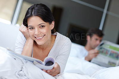 Buy stock photo Woman, smile and portrait with magazine and boyfriend for couple, relationship or happy for love and rest in home. Mexican female person or girlfriend and satisfied with partner for wakeup in morning