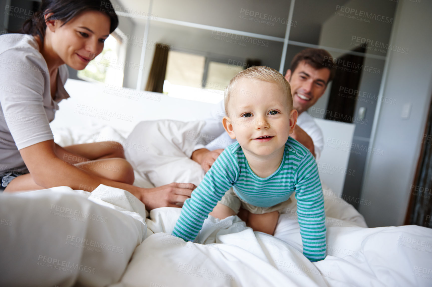 Buy stock photo Shot of an adorable family spending time together indoors 