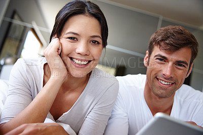 Buy stock photo Couple, tablet and portrait for movie in home, watching and streaming film online on app or website. Happy people, entertainment and relax in marriage, bonding together and series on internet or tech