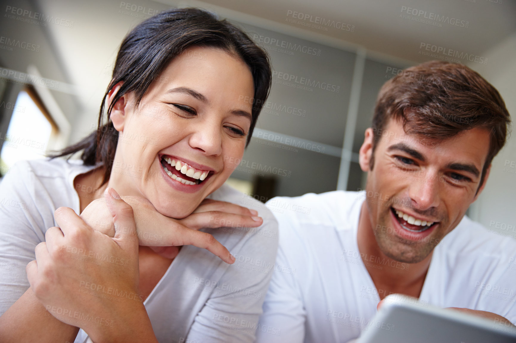 Buy stock photo Couple, tablet and funny movie in home, watching and streaming film online on app or website. People, entertainment and laughing for comedy, bonding and humor series on internet and comic on tech