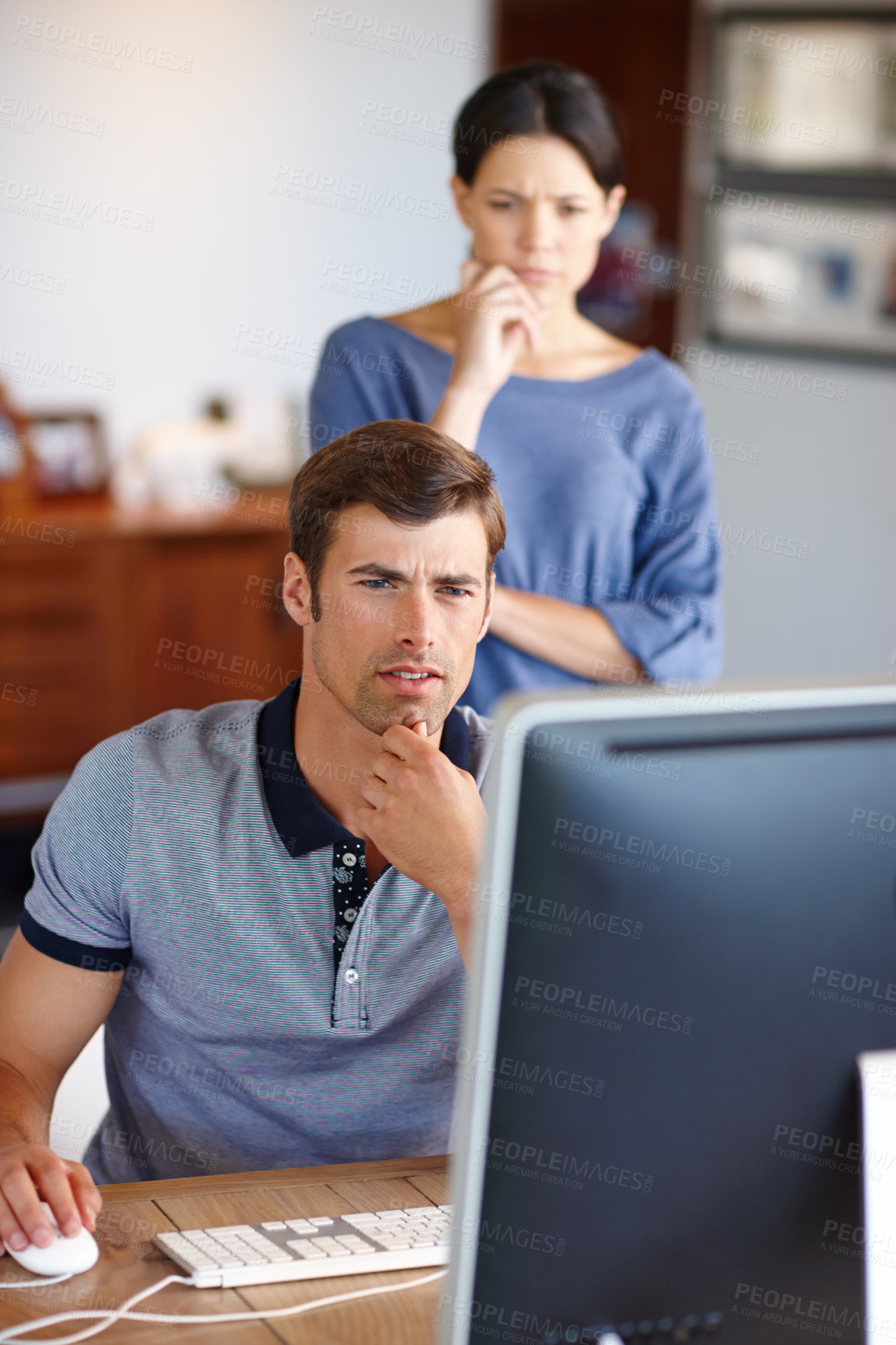 Buy stock photo Cropped shot of a young couple using a computer at home 