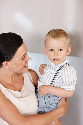 Buy stock photo Cropped shot of a mother and son bonding indoors 