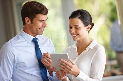 Buy stock photo Colleagues, smile and discuss deal on tablet for partnership, teamwork or negotiation. Business people, confident or happy after interview, contract discussion or in office meeting for employment