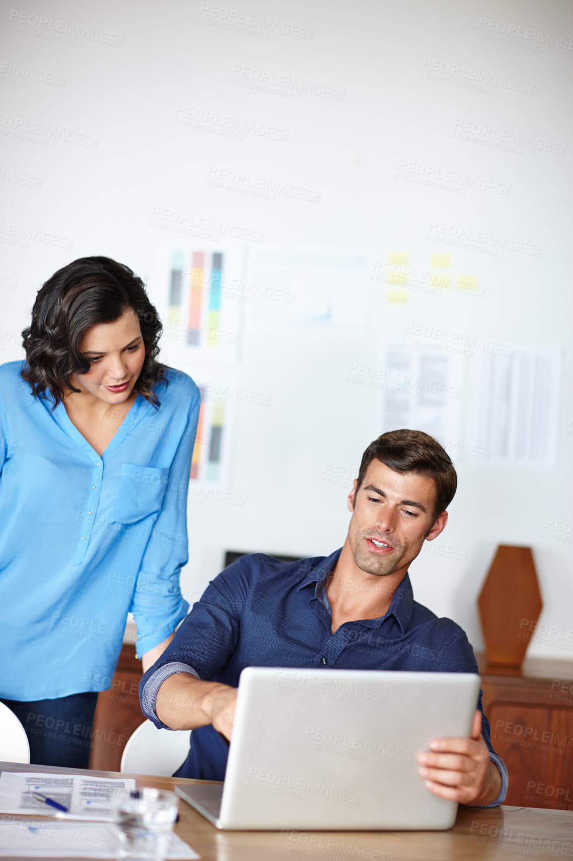 Buy stock photo Businessman, office and pointing at laptop with woman at desk for idea, planning, and information for project proposal. Professional, person and working on computer for finance report on company