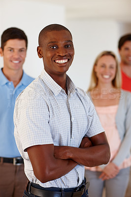 Buy stock photo Portrait, black man and smile in office with pride for working, business and group. Male worker, professional and happy in workplace with support for design employee, creative and cooperation
