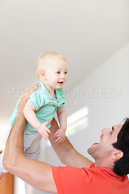 Buy stock photo Father, toddler and play game for fun, love and bonding for child development in home. Happy daddy, boy and holding in embrace or single parent in living room, comfort and security in connection