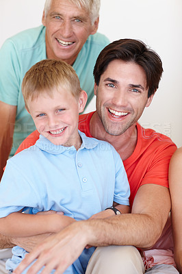 Buy stock photo Portrait, grandfather and father with boy in happy, house and family in growth, development and childcare on sofa. Mature man, dad and kid with cheerful, smile and playing in living room for bonding
