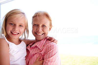Buy stock photo Portrait, grandmother and girl with generations at family house by embrace, bonding and love in garden. Grandma, people and child in outdoors on vacation at childhood home with nature for memory