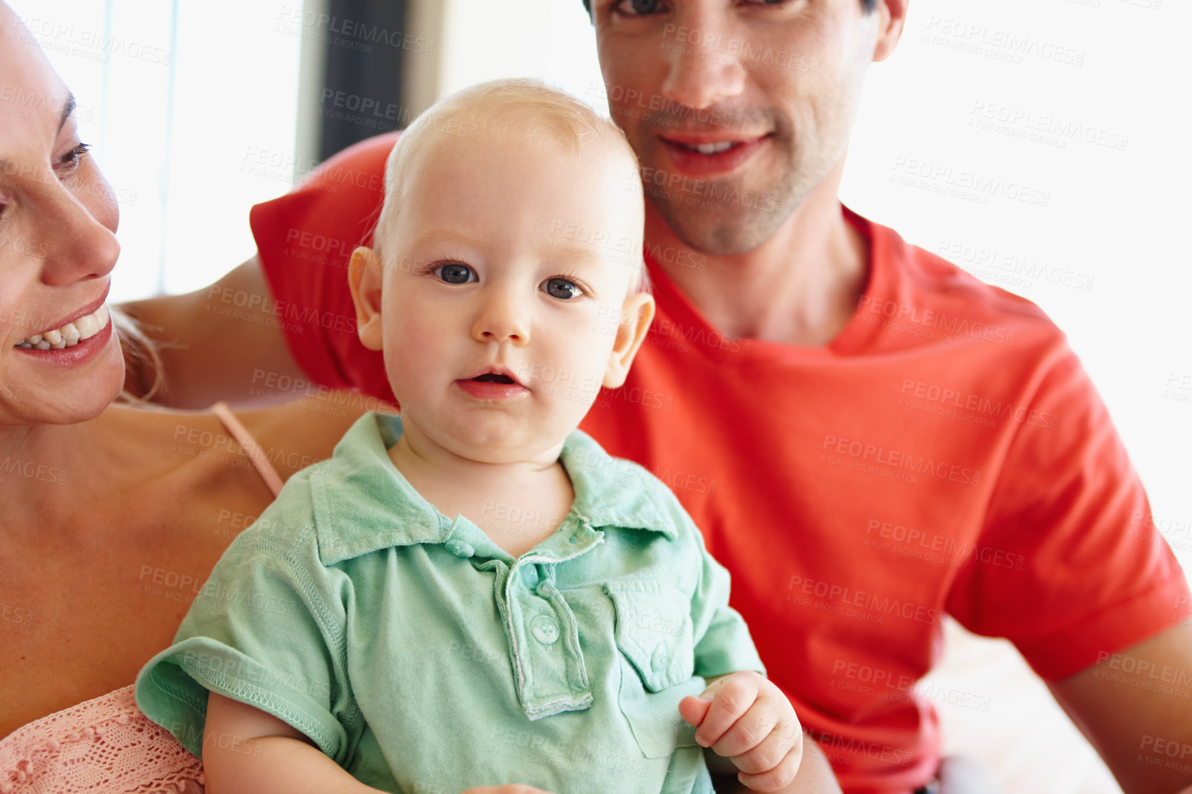 Buy stock photo Parents, happy and hug baby in portrait at home for learning, development and bonding together. Mom, father and love child smile in living room for family, relationship or memories with each other