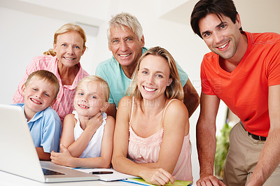 Buy stock photo Happy, parents and grandparents in lounge on laptop with children for entertainment at home for development. Mom, dad and siblings bonding on vacation to visit grandma, grandpa and childhood house
