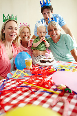 Buy stock photo Portrait, multi generation or family at birthday, party or event to care, love or bonding together. Grandma, mama or baby in smile, paper hat or balloons in colorful memory of childhood growth