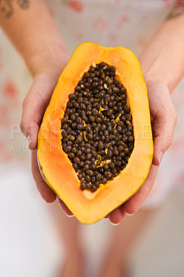 Buy stock photo Fruit, papaya and hands in half with seeds for nutrition for healthy eating, nutrients and wellness. Above, pawpaw and diet with snack for weight loss with vitamin c for freshness with balance