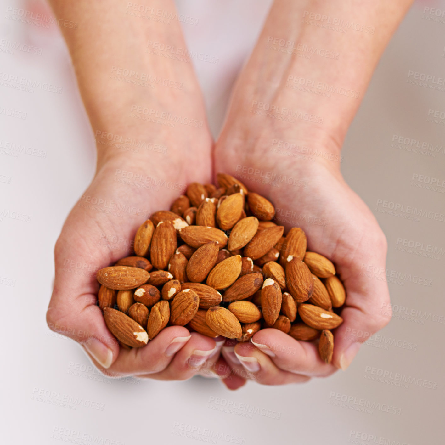 Buy stock photo Woman, hands and almonds as fruit of vegetarian for health, wellness and balanced diet with nutrition snacks for farming. Person, fibre and natural vitamin with protein for digestion or weight loss