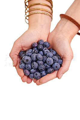 Buy stock photo Cropped studio shot of a bunch of blueberries in a person's cupped hands