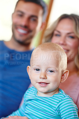 Buy stock photo Couple, baby and closeup on sofa with smile at house, learning or development and bonding. Man, woman and child in living room with portrait on couch for togetherness, family time or happiness

