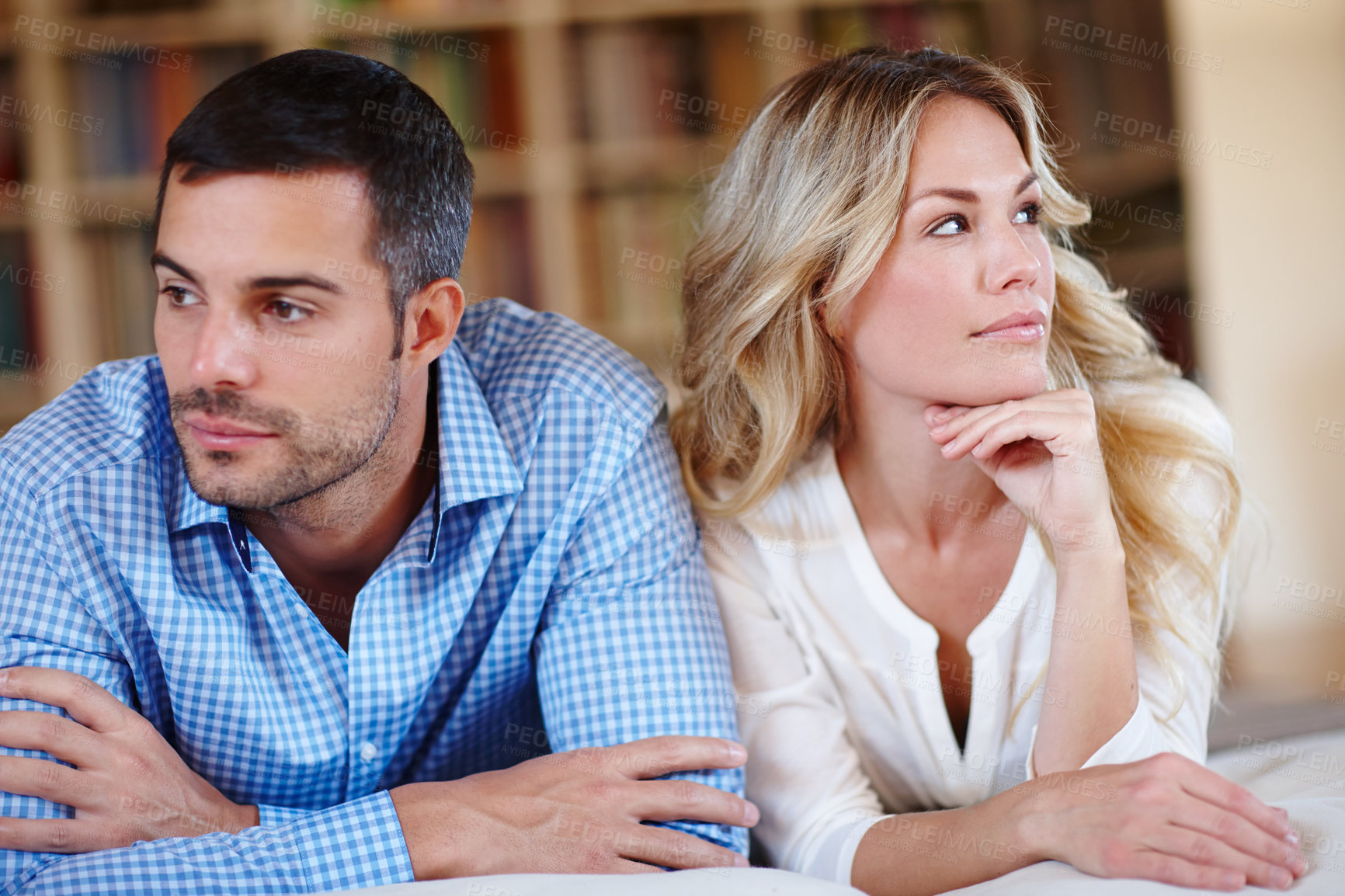 Buy stock photo Annoyed, married and couple with argument at home in lounge together from toxic relationship conflict. Frustrated, man and woman in house, angry and silent treatment with stress from divorce crisis