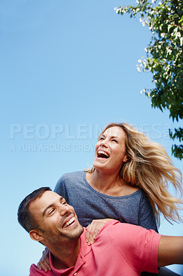 Buy stock photo Couple, laugh and blue sky on shoulders and sunny with trees, relationship or holiday with outside. Man, girlfriend and together or smile on vacation or honeymoon, bonding and summer or dating