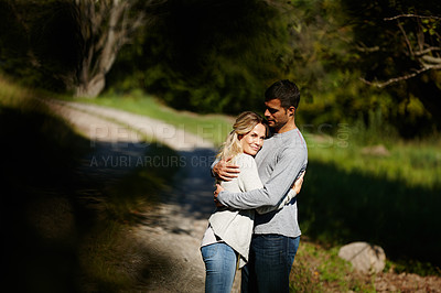 Buy stock photo Couple, hug and happy in park for love, bonding with care and support in healthy relationship. Man, woman and smile outdoor for date with romance, trust and commitment for marriage or partner