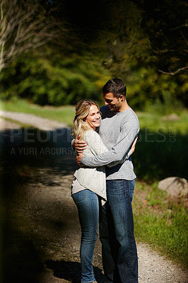 Buy stock photo Couple, hug and happiness in park for love, bonding with care and support in healthy relationship. Man, woman and smile outdoor for date with romance, trust and commitment for marriage or partner