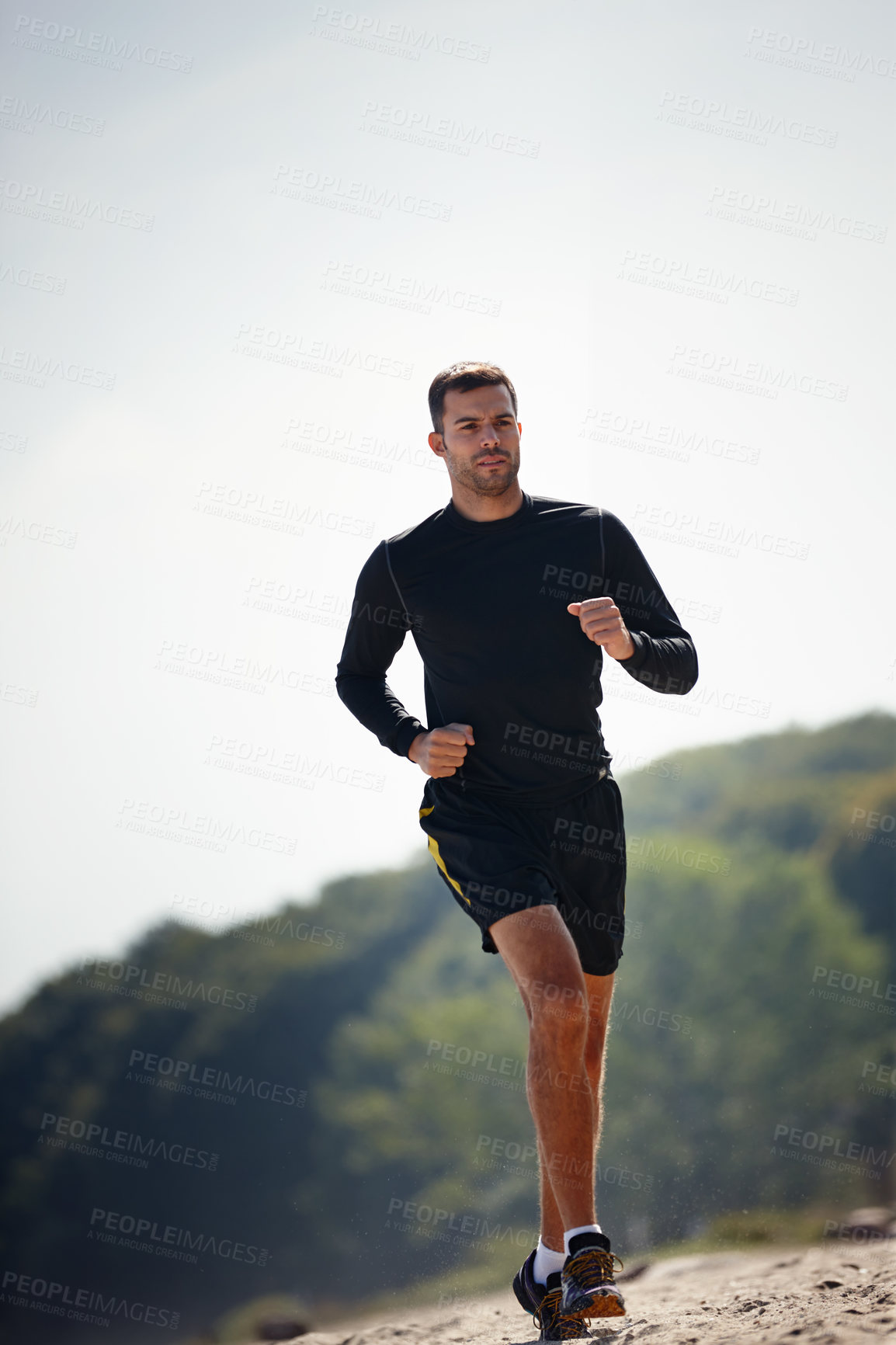 Buy stock photo Running, athlete and man outdoor for sports with energy for practice, exercise and health in nature. Workout, runner and training for marathon, forest and performance of speed of male person