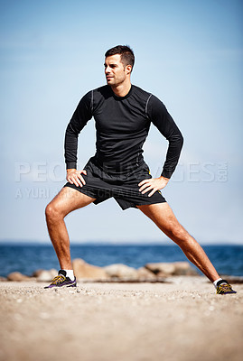 Buy stock photo Man, stretching and ocean on sand with shoes for health, fitness and exercise by beach for peace and calm. Athlete, yoga and sea in morning for wellness, motivation and workout or training by nature