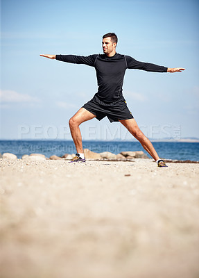 Buy stock photo Athlete, stretching and beach on sand with shoes for health, fitness and exercise by ocean for peace and calm. Man, yoga and sea in morning for wellness, motivation and workout or training by nature