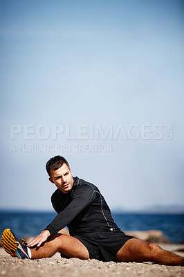 Buy stock photo Man, stretching and sports by ocean for exercise with fitness motivation, sand and blue sky. Male person, training and nature at beach with workout for wellness, strong body and health activity