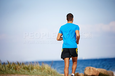 Buy stock photo Male athlete, outdoor and running for fitness, health and wellness in nature for workout or exercise. Sporty man, training and cardio with endurance, muscles and strength for healthy living or gym