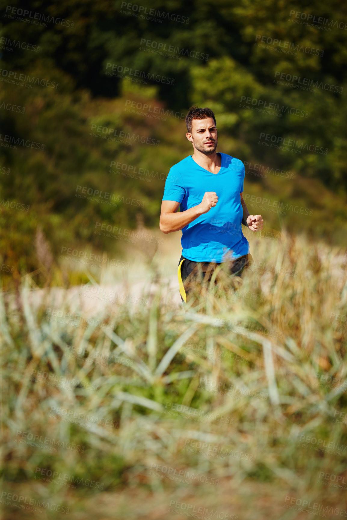 Buy stock photo Sporty, man and running in nature for fitness, health and wellness in outdoor for workout or exercise. Male person, training and cardio with endurance, muscles and strength for healthy living or gym