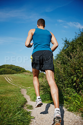 Buy stock photo Male person, fit and running in outdoor for exercise, health and wellness in nature for workout. Sporty man, training and cardio with endurance, muscles and strength for healthy living or gym
