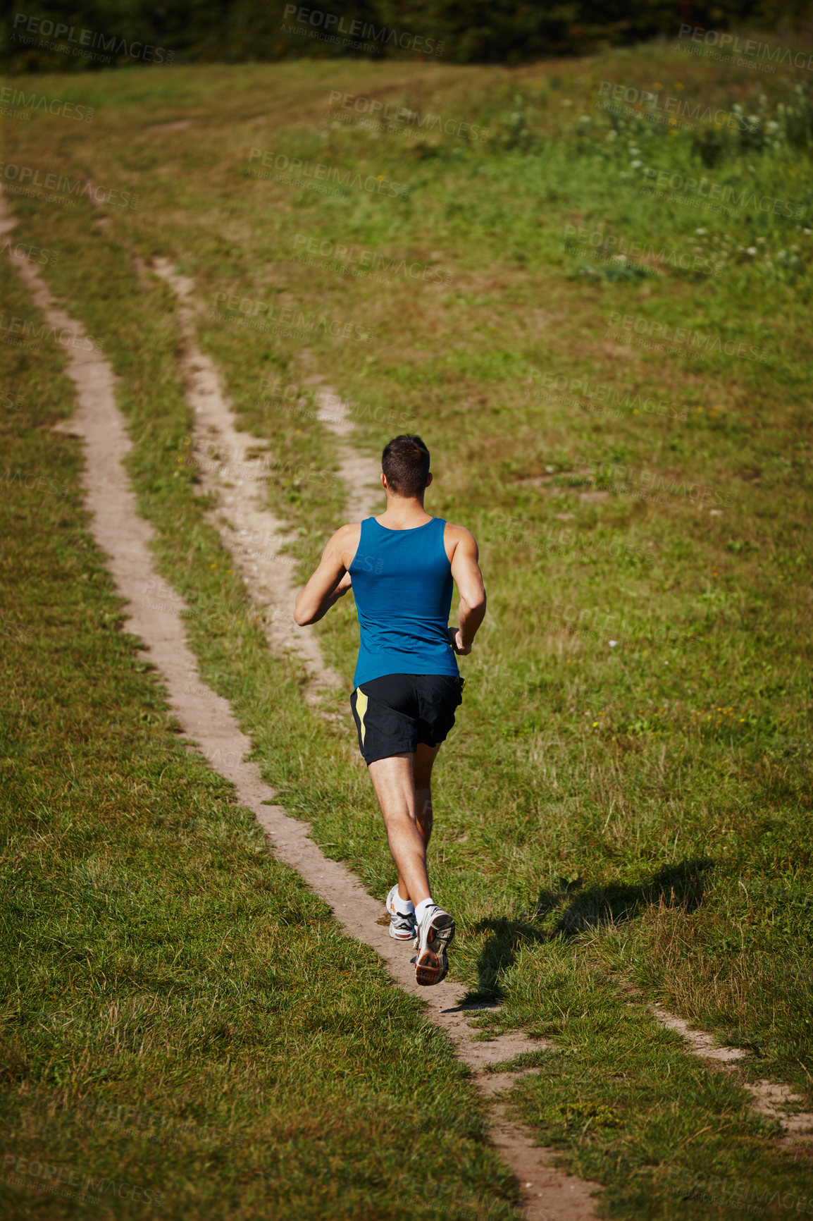 Buy stock photo Sporty, man and running in outdoor for fitness, health and wellness in nature for workout or exercise. Male athlete, training and cardio with endurance, muscles and strength for healthy living or gym