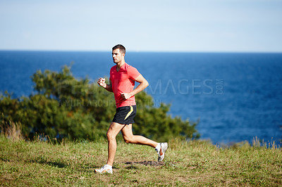 Buy stock photo Runner, man and sports in nature for fitness, health and wellness in outdoor for workout or exercise. Male athlete, training and cardio with endurance, muscles and strength for healthy living or gym
