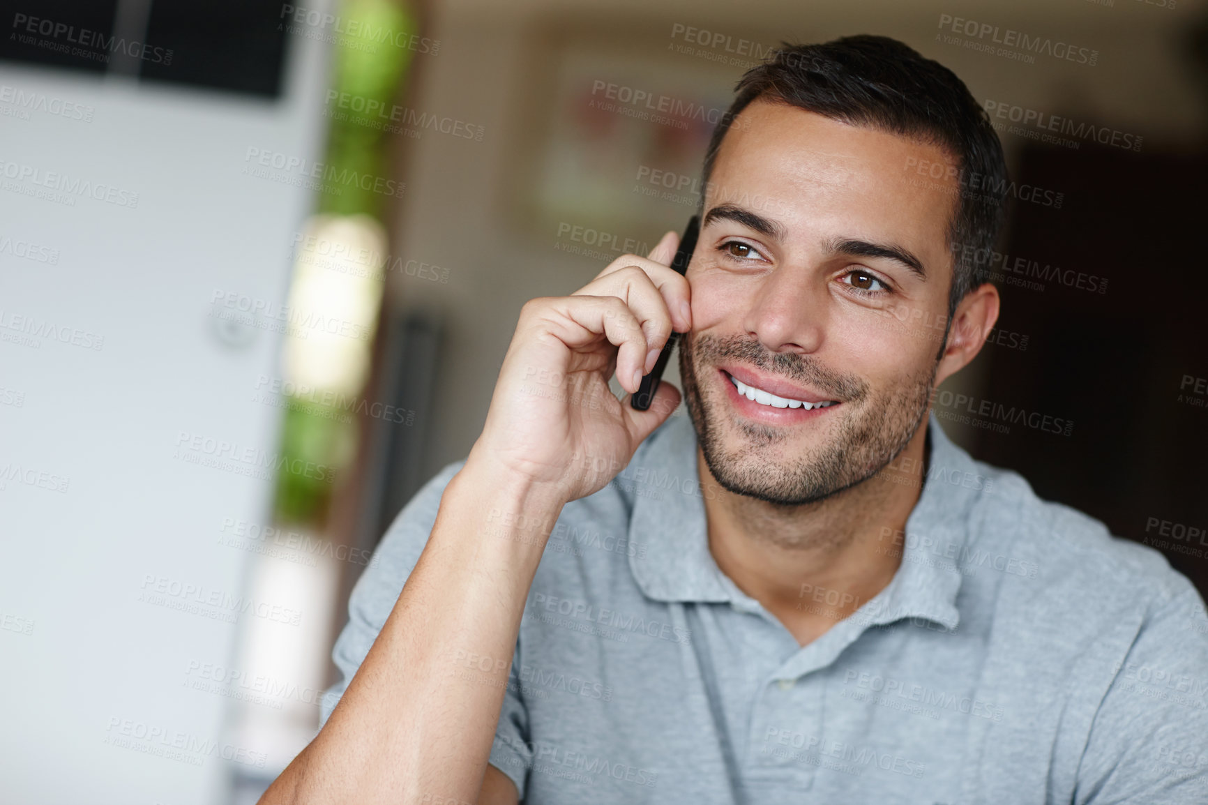 Buy stock photo Man, smile and happy with phone call discussion in home for new work, freelancing or good news. Person, confident and relaxed communication on mobile for remote job, online interview or employment