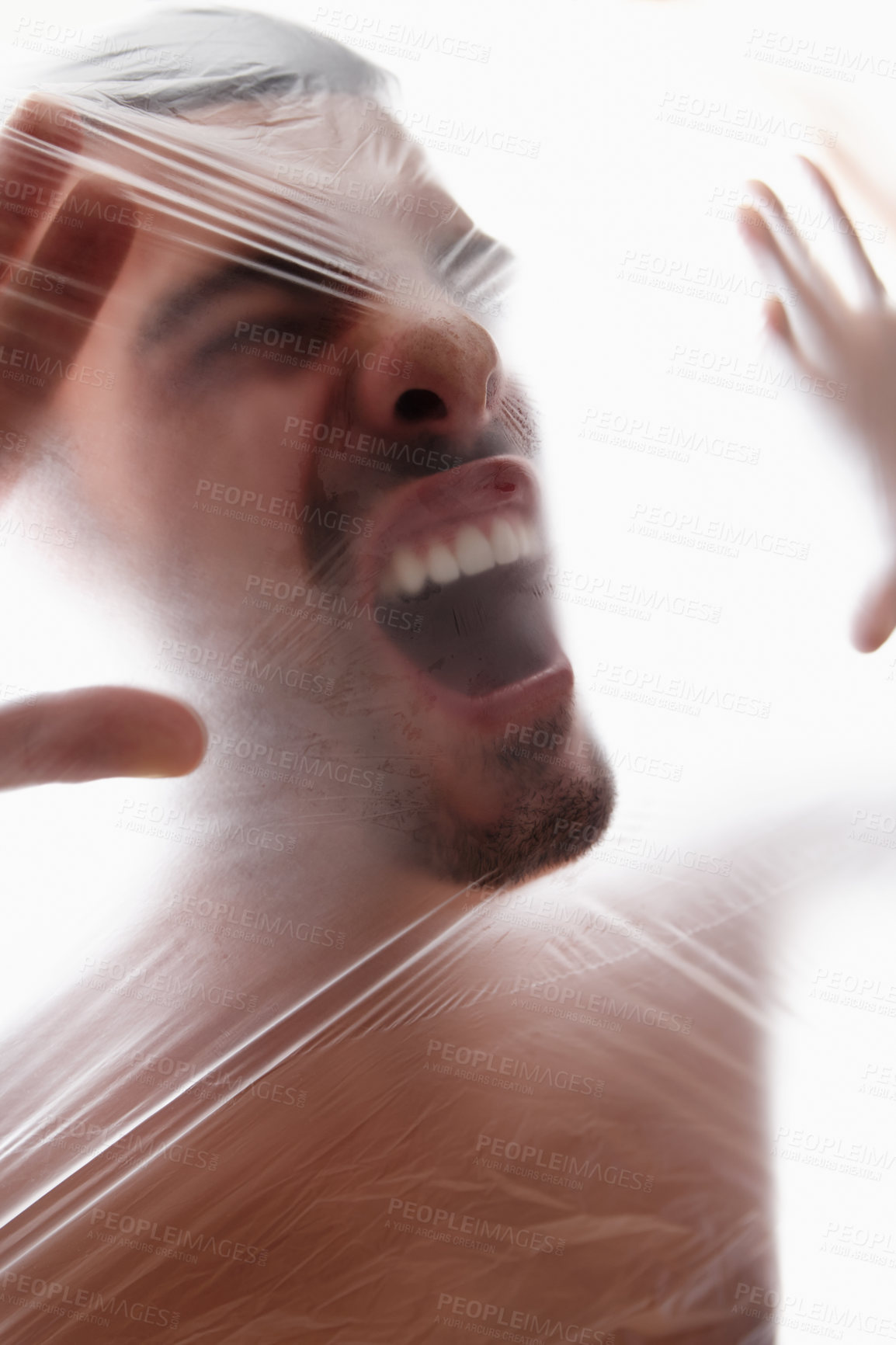 Buy stock photo Male person, plastic and bag with choking, gasping and struggle for air in white background. Man, expression and suffocating in crisis for awareness, help and anxiety in mental health or wellness