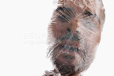 Buy stock photo Man, plastic and bag with choking, breath and struggle for breath in white background. Male person, expression and suffocating in crisis for awareness, help and anxiety in mental health or wellness