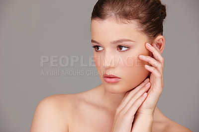 Buy stock photo Confident, woman and hands in studio for clean beauty, skincare and wellness isolated on grey background. Cosmetics, collagen and dermatology with pride, facial and treatment of face for glow