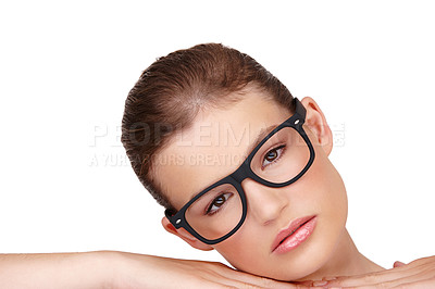 Buy stock photo Portrait of a beautiful young caucasian woman wearing thick rimmed glasses isolated on white background. Headshot of female laying her head on her hands looking relaxed wearing stylish spectacles