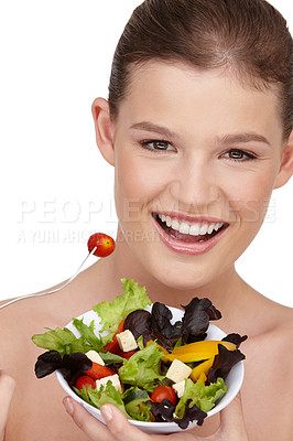 Buy stock photo Close-up shot of a teenage girl holding a bowl of healthy salad