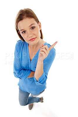 Buy stock photo Top view, pointing and portrait of girl in studio for college registration, notification or information with white background. Show, student or gen z model for university guide, advice or decision
