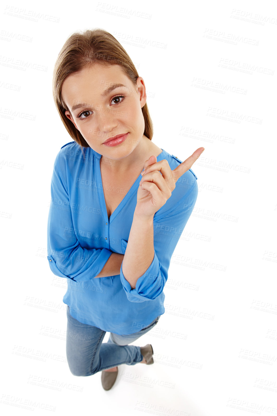 Buy stock photo Top view, pointing and portrait of girl in studio for college registration, notification or information with white background. Show, student or gen z model for university guide, advice or decision
