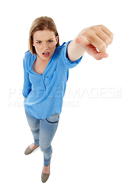 Buy stock photo Angry, portrait and girl with hand pointing at you in studio top view for choice, direction and accountability on white back. Hey, face and gen z model show finger emoji for decision, stop or warning