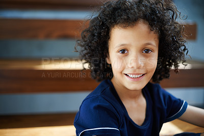 Buy stock photo Portrait of a smiling boy posing on the steps