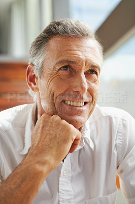 Buy stock photo Senior man, smile and thinking at home for decision, choice or idea on retirement and pension. Mature person, thought or wonder in house contemplating for memories, reflection or moment alone