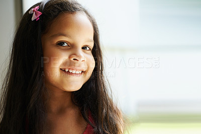 Buy stock photo Cropped view of a cute little girl looking at the camera