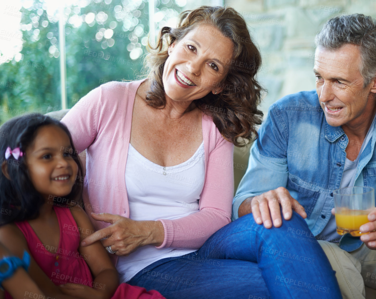 Buy stock photo Portrait, bonding and happy family on sofa for conversation, love or talking in house. Smile, house and grandmother, grandfather and child on couch for comfort, care and joke together in home lounge